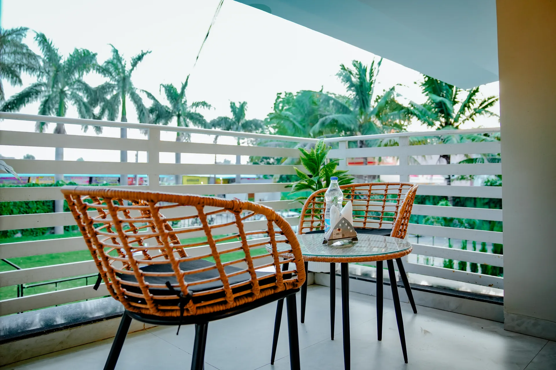 A peaceful balcony overlooking palms at Amber